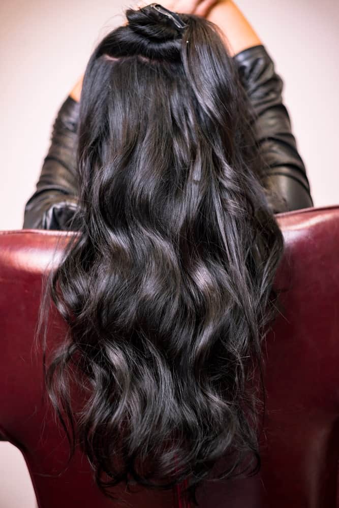 These are perfectly symmetrical wave-like curls that have been swept all the way towards the back.
