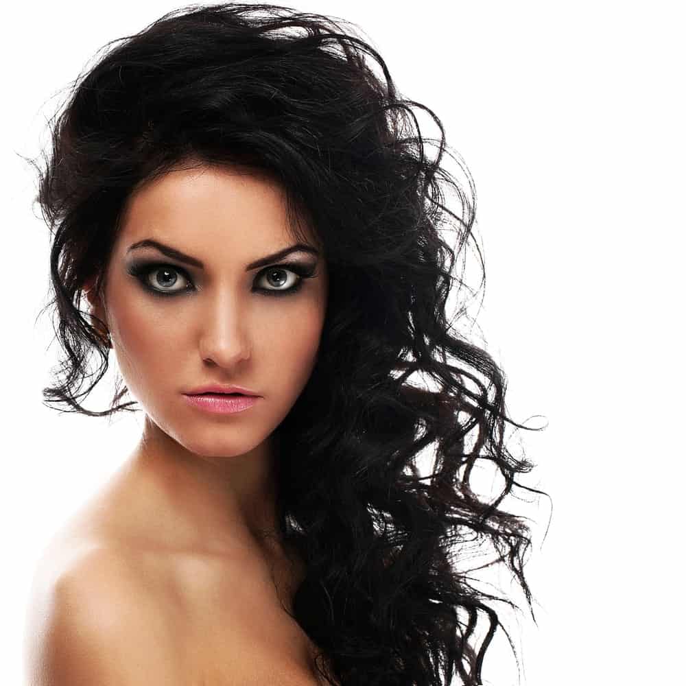 These are towering-like curls with all the hair from one side swept to the other side and has small loose curls.