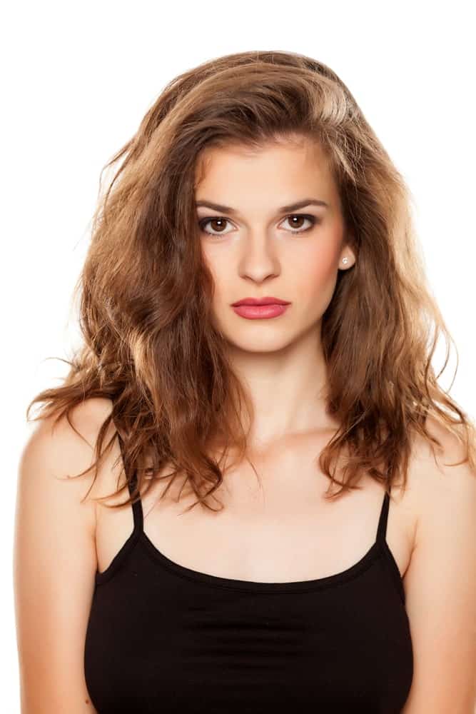 This is more of a messy, tousled layered hairstyle with a full side-parting. The layers on the top are slightly shorter than those towards the bottom. 