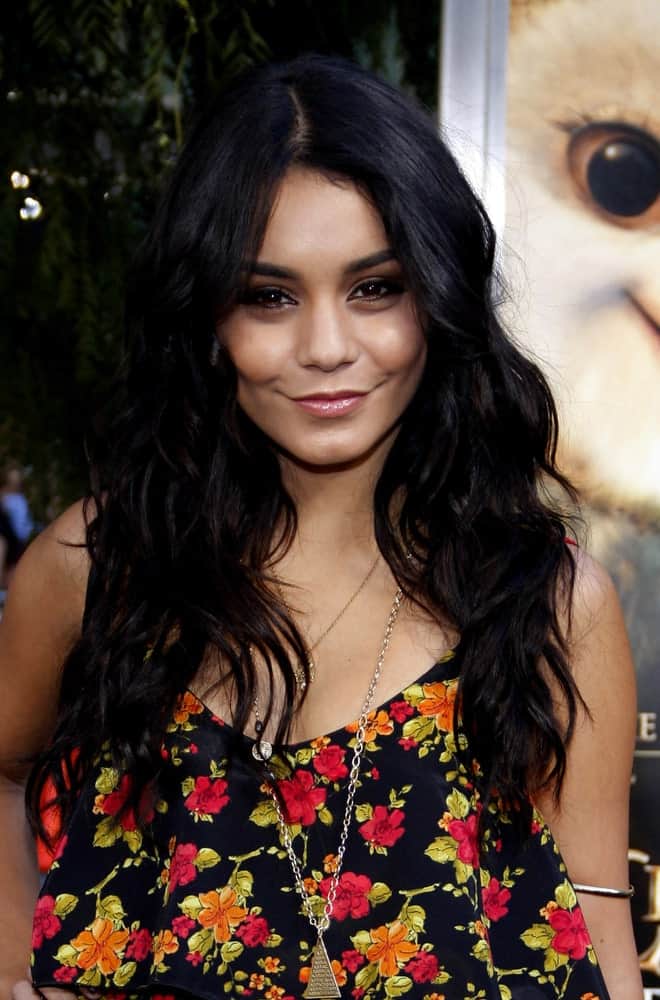 Vanessa Hudgens styles her long hair all let down and fashioned into slight and subtle curls.