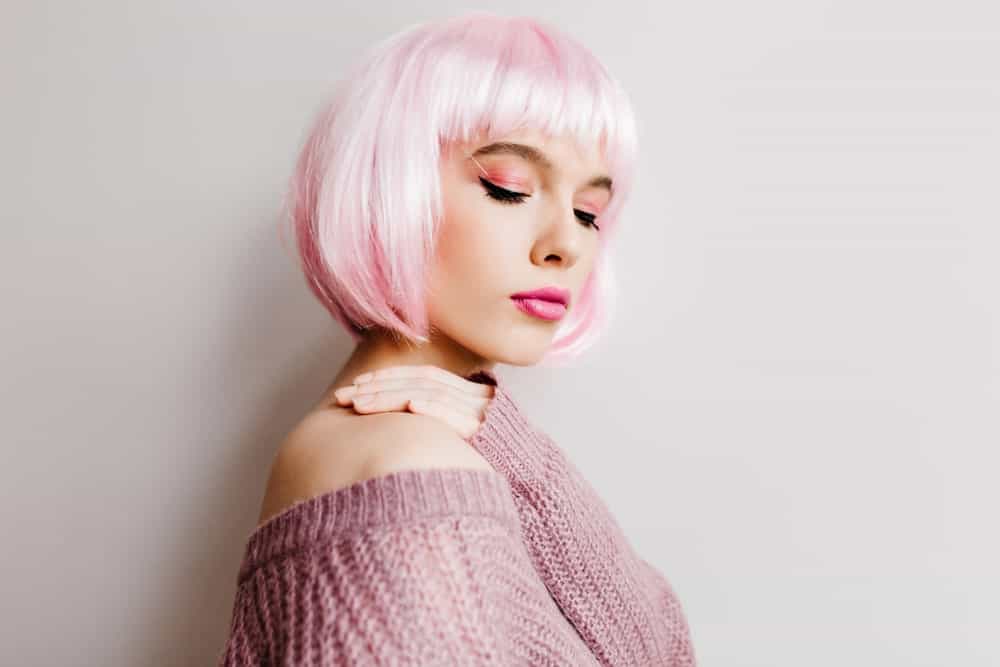 From whistleblower Christopher Wylie to socialite Khloe Kardashian, a lot of people have turned to rocking pink hair, alongside the silver locks. You can give your hair a two-toned look by blending pink and white tones for a whimsical look or graduate your natural locks to a pink color. The choice is yours.