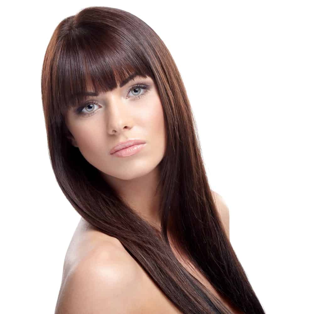 This is another classic hairstyle with super straight and sleek hair that has been gathered together on both sides. It also has very neatly cut straight fringes in the front, making it look really cute and funky.