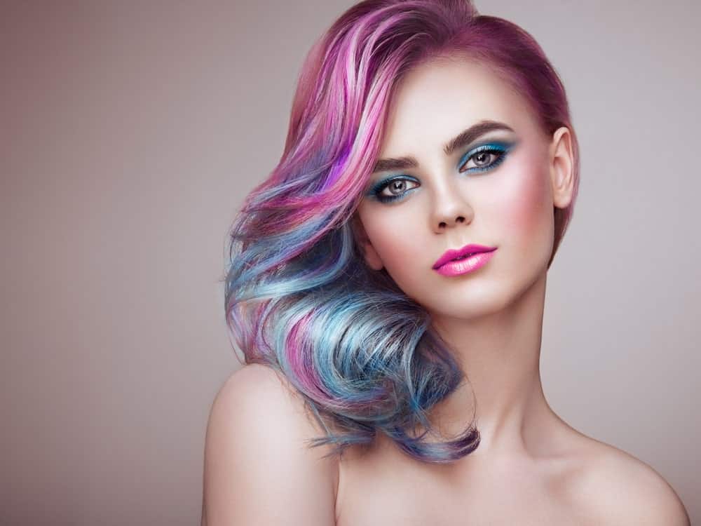 Have a flight of fantasy with parti-colored mermaid hair. If you are a fan of the super-casual and eclectic looks, this is one of the ombre styles you should try. Ask your stylist to paint in a combination of bright, vivid, rainbow colors like pink, purple, green and aqua, to achieve this super-sultry effect.  
