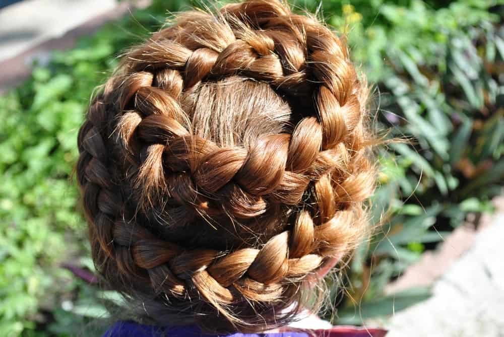 If you want your hairstyle to be unique and intricate, then this is the hairdo just for you. This is the kind of braid that involves French braiding in a circular motion from the crown all the way to the nape of your neck. Have this jaw-dropping hairstyle to perfection by hiring a professional hair stylist for the job.