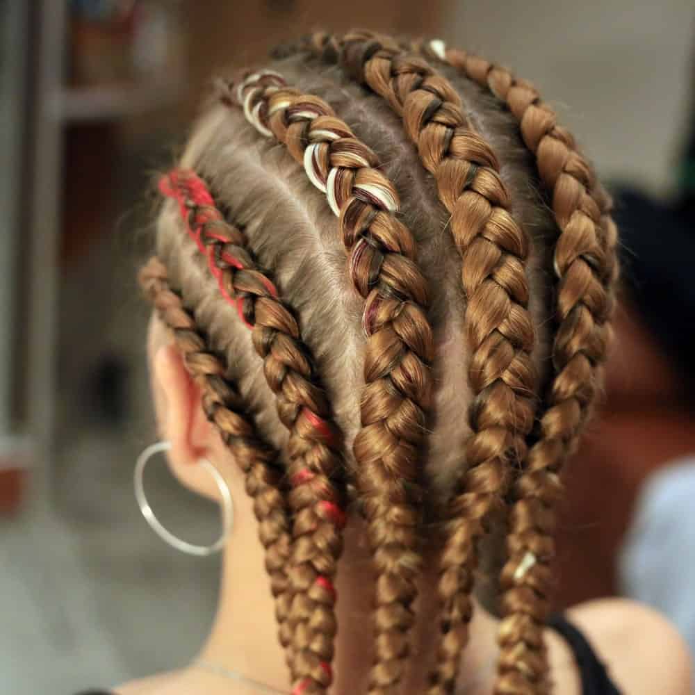 While this type of braided hairstyle originated from traditional African fashion, women all over the world try carrying it because of its cool style. From the side cornrow braid to thick, middle cornrow braids, the options to experiment this hippy hairstyle are plenty.