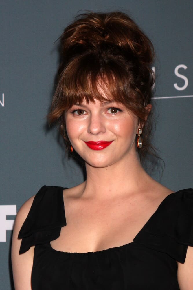 Amber Tamblyn unleashes her fun and carefree personality with this messy upstyle with bangs she wore in 2012.
