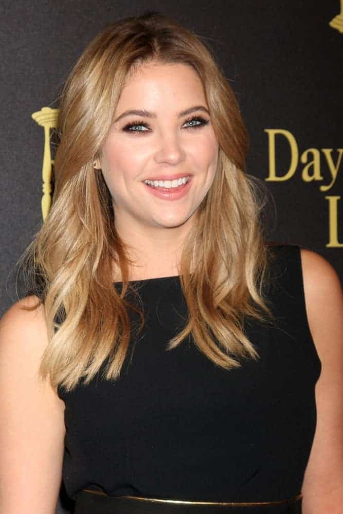 Ashley Benson flashed a lovely smile at the Days of Our Lives 50th Anniversary Party at the Hollywood Palladium on November 7, 2015, in Los Angeles, CA. She came wearing a black dress with her sandy blonde loose and tousled hairstyle with subtle waves and layers.