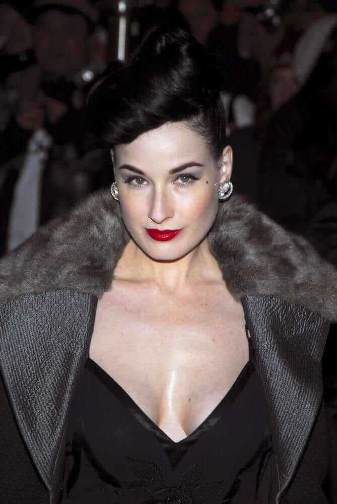 You will definitely adore Dita Von Teese with her thick hair styled into a big roll of twisted pompadour in 2006.