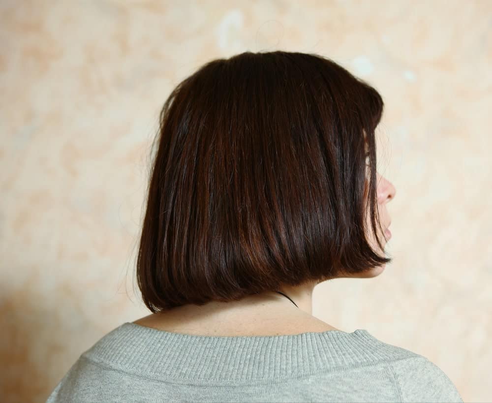 If you are one of those who like to keep their hair game simple yet stylish, this hairstyle might just work for you. It is a slightly angular bob with super straight and sleek hair that fall on the nape of the neck. 