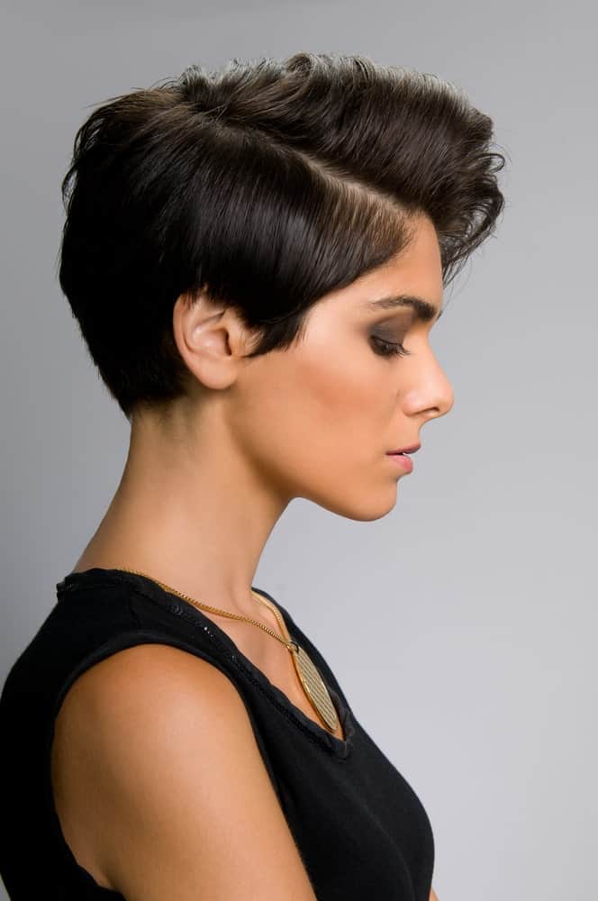 Not everyone fancies going big and bold with their hair but if you are a risk-taker, this hairstyle is for you. It is another classic pixie-inspired cut with a neat side parting. The hair from the top has been poofed a little to give it more volume and texture and the hair at the back has been set in a gelled-back manner to give it a clean, sharp look.