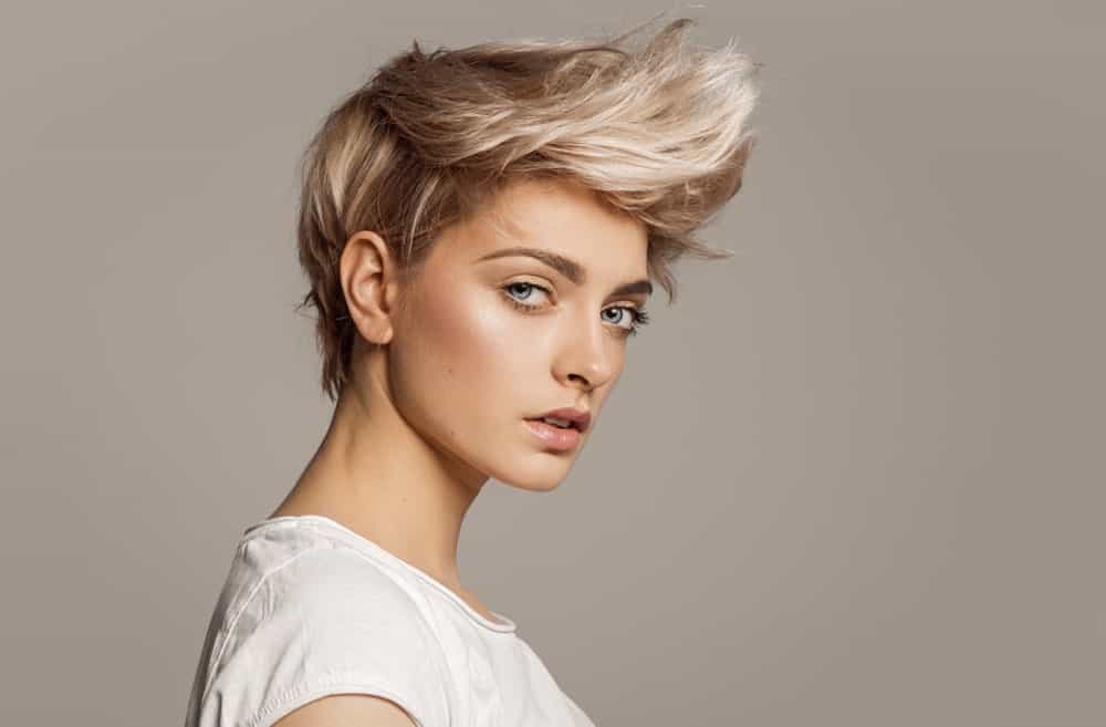 If you want to highlight your jaw and cheekbones, try a super-short hairstyle with a faux hawk. You can also personalize the look by asking your stylist to color your front hair in a contrasting hue to your back and side hair.