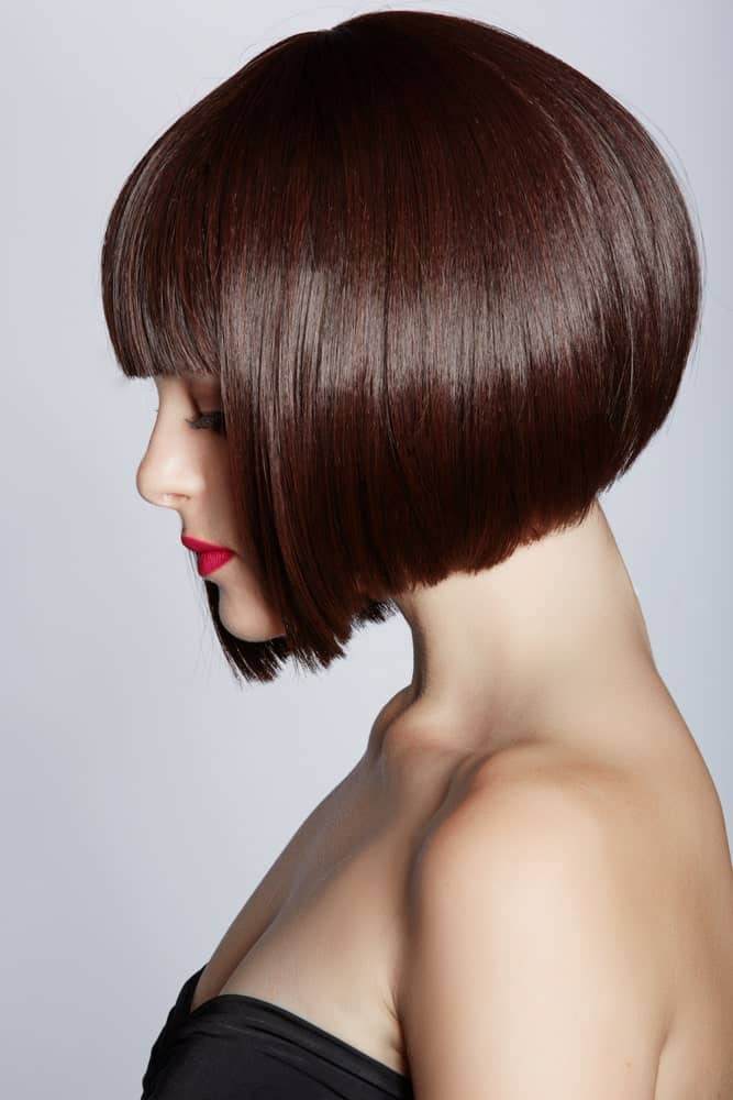 This has to be one of the most stunning and absolutely chic bobs that go from short in the back to slightly longer in the front. It also appears to be a super voluminous style with short bangs in the front to give the hair a little texture. 