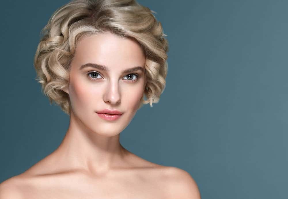 Another classic short hairstyle, this is an uber-short pixie-like bob with small tight curls going all over the head. While it does look like it has come right of the ancient era, it still looks super chic and modern.