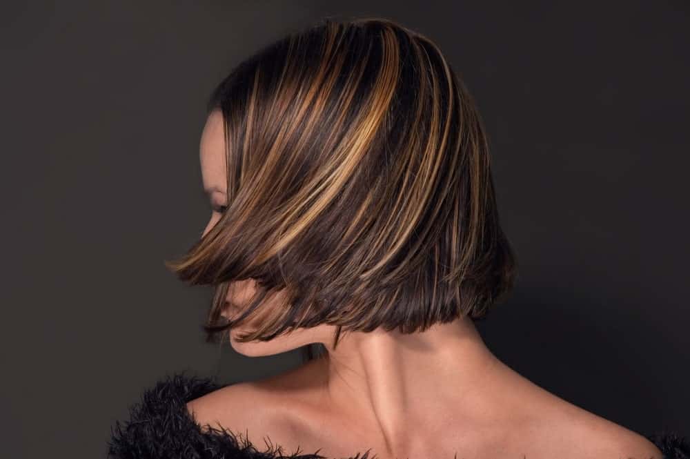 If you have short, brown hair and are looking to transform them, this is an excellent hairstyle for you. It has shades of light brown and light gold going all over from top to bottom, making it look absolutely beautiful.