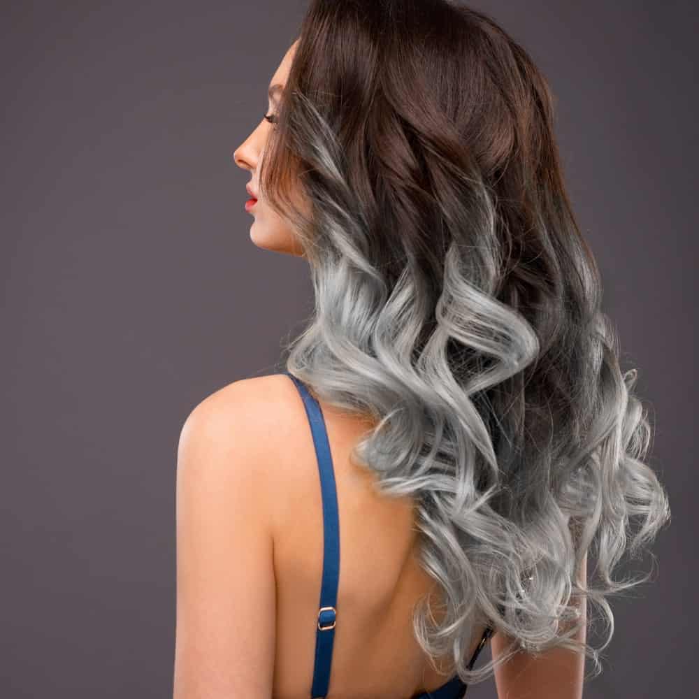 Not everyone can perfectly don a risky hair color combination, but for all those who can, this is the best one for you. This is nothing short of beautiful with ombre hair from the top followed by low silver lights all the way down. It is simply funky, pretty and just so unique!