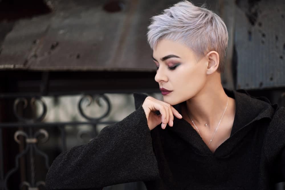 To achieve the undercut pixie look, keep the hair on the back super short, while leaving the ones on top longer. Ask your stylist to give your hair some choppy layers to give it volume. Dye it silver and purple for a gothic, grunge look.