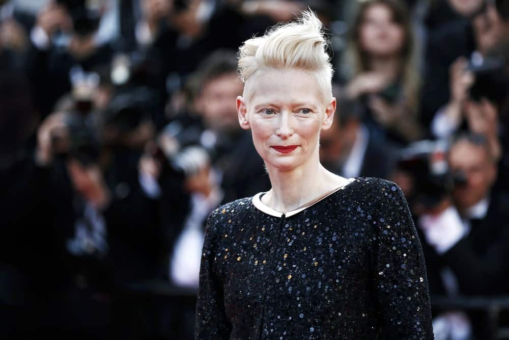 Tilda Swinton has worn her hair super short for several years and has tried dozens of glamorous styleson it. This one features a very extra pompadour that flips her long front hair back. The actress has lefther side hair much shorter and it makes for a super-cool and fun style.