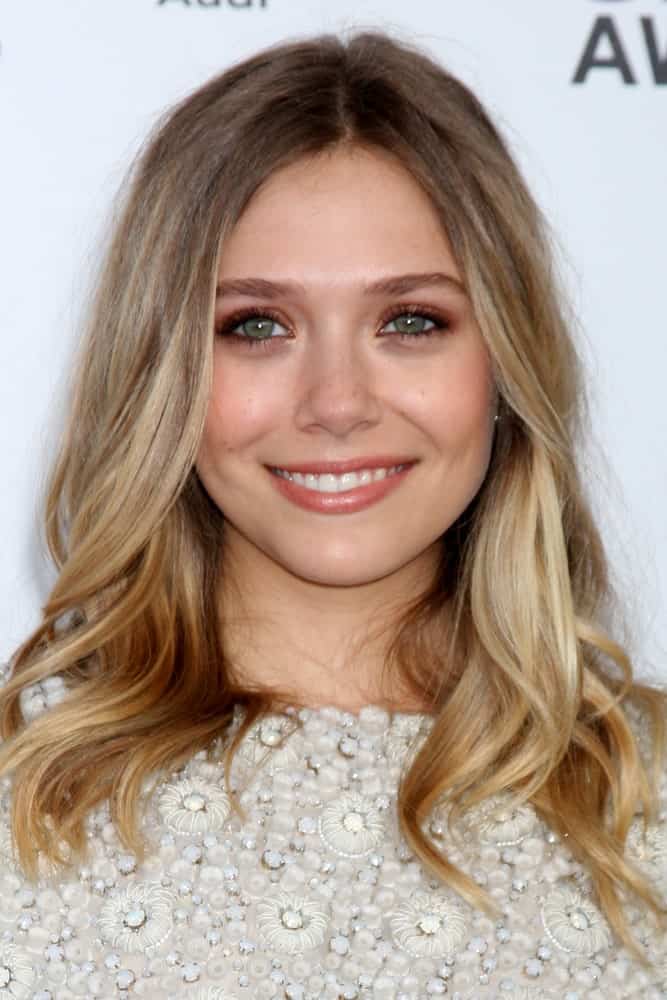 This is one of the famous Olsen twins looking beautiful in her highlighted hair that ash-brown from the top followed by wavy golden-blonde highlights at the bottom.