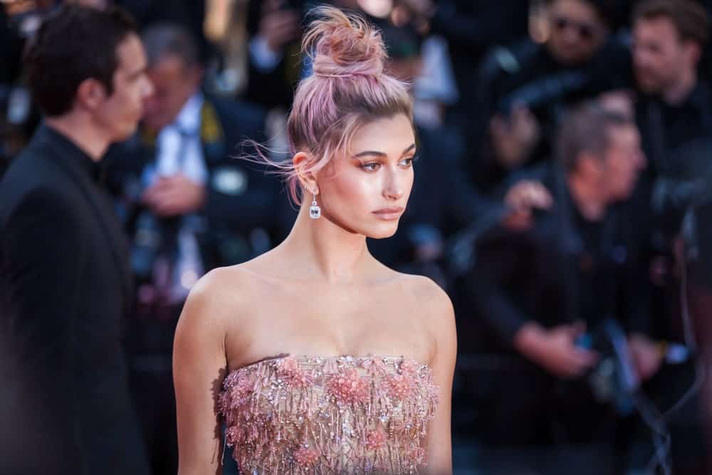 Hailey Baldwin gave her ash blonde hair subtle pink and lavender highlights and twisted it up into a ballerina top knot. The artfully-painted color was elegant enough to rock with a ball gown and to attend the Cannes Film Festival.