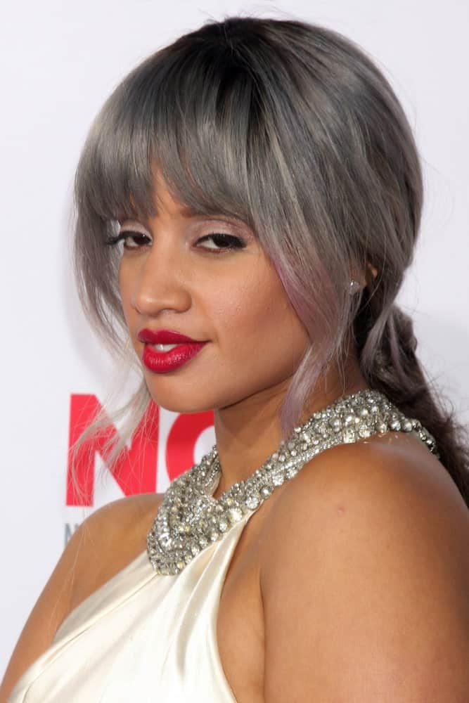 Dascha Polanco who plays Dayanara Diaz in the hit American TV series, Orange is the New Black, can be deemed as a trendsetter who introduced gray hair color in contemporary fashion, back in 2014. Inspired by her hairstylist who used to wear a gray wig, the actress decided to sport the color herself as well. However, instead of a whitewashing her hair with gray, she went for a color gradient for a more natural and fascinating look. Orange is the New Black? More like gray is the new black!