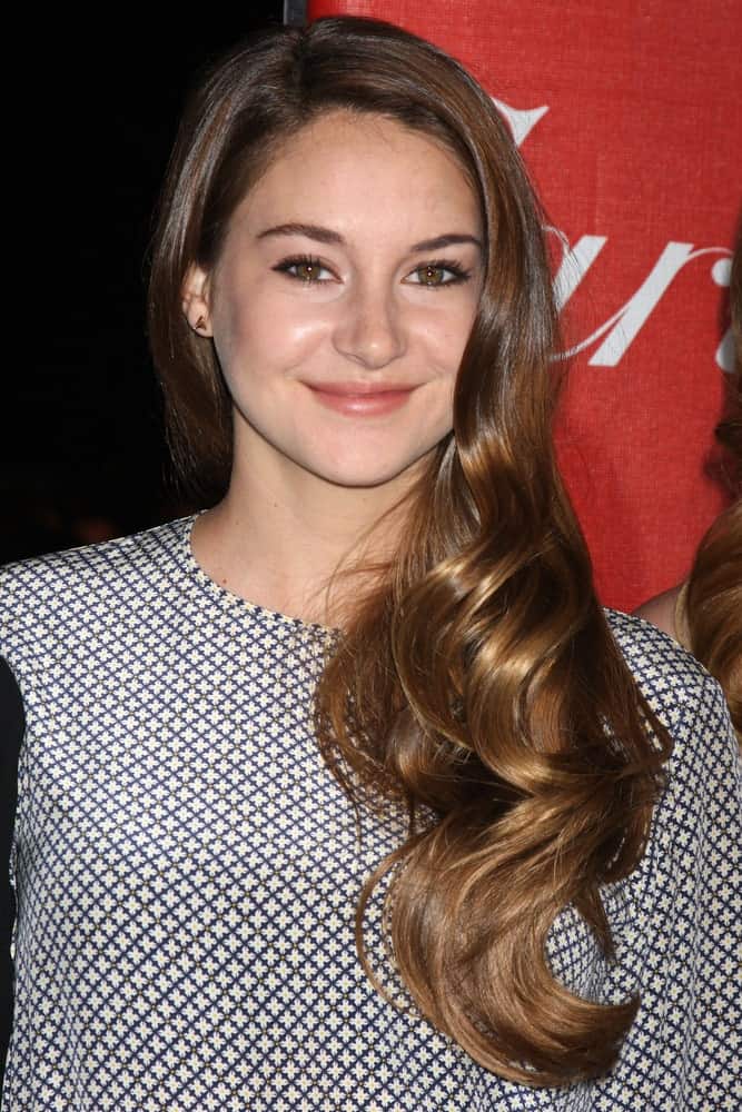 She has been an advocate of short pixie cuts for a long time but here we see the lovely Shailene Woodley sporting a completely different style. Her extra long hair is extra tousled and has been swooped in front to look like a golden waterfall.