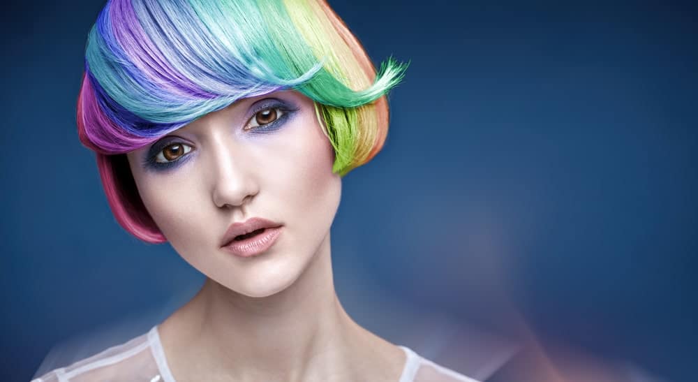 This is an example of a perfect rainbow bob. This model’s hair has been meticulously painted with all the colors of a rainbow in a perfect gradient. This is a very fun and summery look and is perfect for going to events like Coachella and Burning Man. But make sure you can invest time in maintaining this beautiful look. 