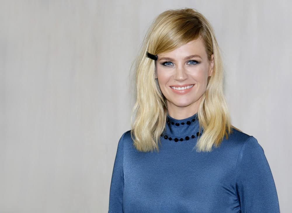 January Jones is the perfect model for blonde women who need some hairspiration. The “Mad Men” actress has donned hundreds of different styles on long, short, and mid-length hair and here is one of our favorites. Jones chopped off her hair till just below shoulder-length and gave it a messy side part. She pinned one side of her hair with a simple clip, giving her a very youthful look. This look is simple, quick to make and looks super adorable.