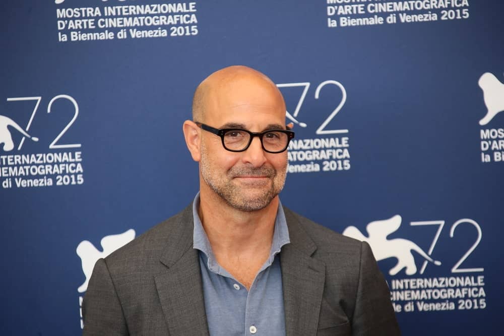 Winner of three prestigious Emmy awards, actor Stanley Tucci, looks super handsome in this formal attire that has been further enhanced by his shaved head, black-grey facial scruff and those dark and thick black-rimmed glasses. He is definitely one of those men who can effortlessly carry a bald head with sheer confidence and style. 