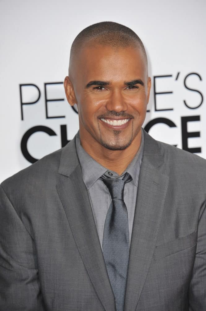 Shemar Moore, the super smart and stylish American fashion model looks simply dashing in this shaved haircut. He sports this buzzed and neat hairstyle flawlessly and the French-inspired beard style simply completes the whole look.