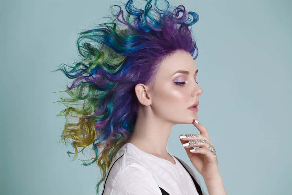 Unlike the fiery colors in the mermaid-style hair above, this hair technique employs darker, more mysterious jewel tones, like dark violet, royal blue, seaweed green, and sandy gold. If you want to go for a dark, edgy mermaid look, these are the colors for you! Old Glory/Superman Bob