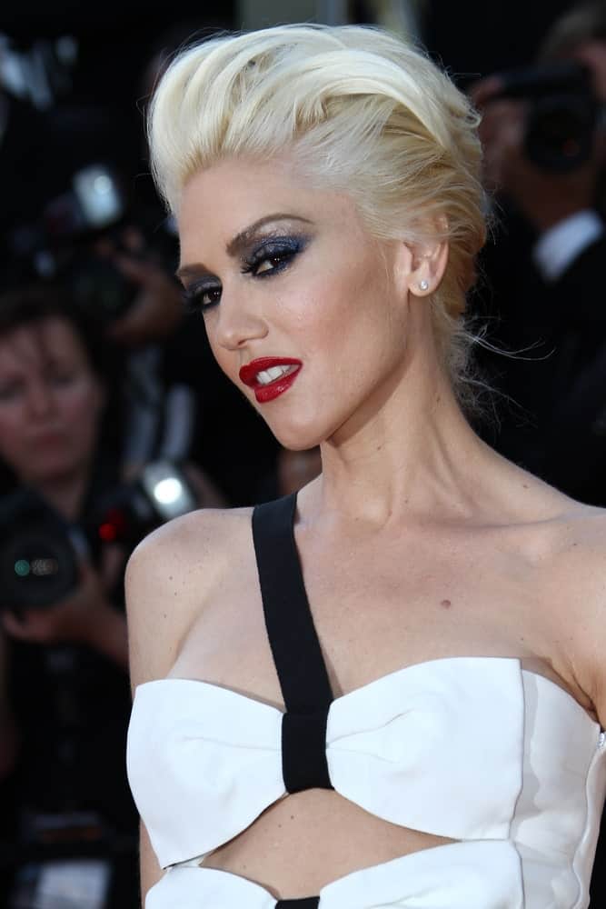 If you have super fine but thick white hair like Gwen Stefani, you can style it in a way that keeps those loose strands off your face. Take some styling products and sweep it through your front hair, pushing it back in an effortless pompadour. This will put more focus on your face.