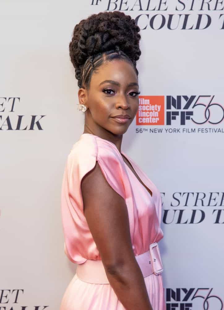 Beautiful actress, Teyonah Parris, debut this stunning look at the 2018 New York Film Festival. The “Survivor’s Remorse” actress styled her hair in a very elegant way, opting for only a few strands of Fulani braids at the front of her head, weaved in geometric patterns. The rest of the actress’ thick, natural hair was twisted in a thick braid, curled up and turned into a stunning bouffant bun at the top of her head.