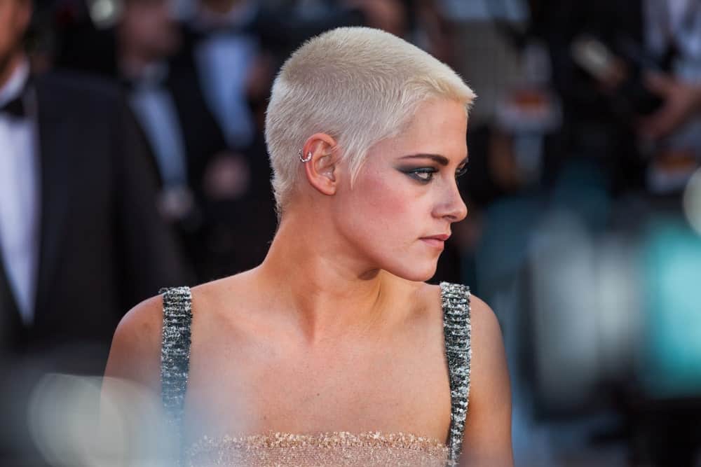 Did you know that white hair could look this good even in a buzz cut? If you are not a fan of long hair and like a little breeze on your neck, it’s time you chop off those long locks – just like Kristen Stewart. Just keep a few millimeters of your hair and color it white to give you a super-edgy look. This hairstyle does wonders for defining your jawline.