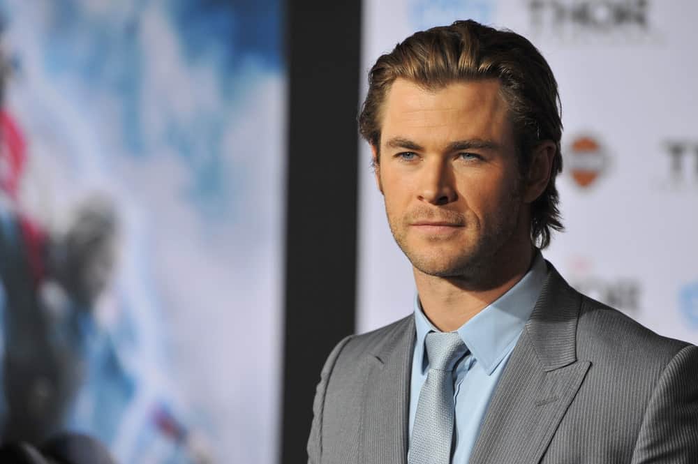 With his rugged good looks, it is no wonder that Chris Hemsworth is one of the most popular actors of the Marvel Cinematic Universe. When he is not playing Thor, the actor cleans up very nicely in a tuxedo and slicked-back hair. Here, the actor has pushed back his brown waves and added just enough styling product to ensure his hair stay in place. His hair was also given some texture and volume so that it doesn’t seem plastered to his head.