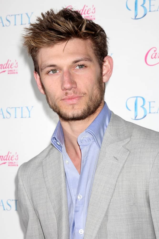 Alex Pettyfer is one of those very few male celebrities with a perfectly chiseled jaw line and complimentary high cheekbones. His hair is also always on-point and here he is, with his short, spiky hair that has been colored a dark brown with hints of very subtle and light gold highlights that pop from within the dark portions of the hair.
