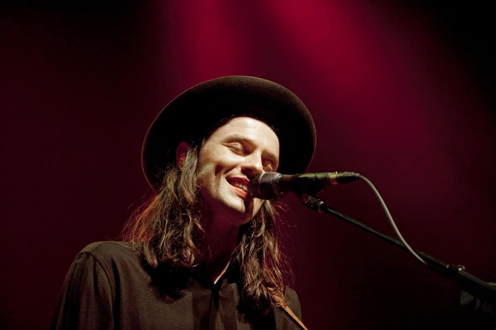 James Bay looks like an absolute rock star here with his uber long wavy hair that has been a colored a beautiful shade of brown. He has accentuated the whole long hair look with a cowboy like hat that makes him look like he has come right out of a fashion magazine.