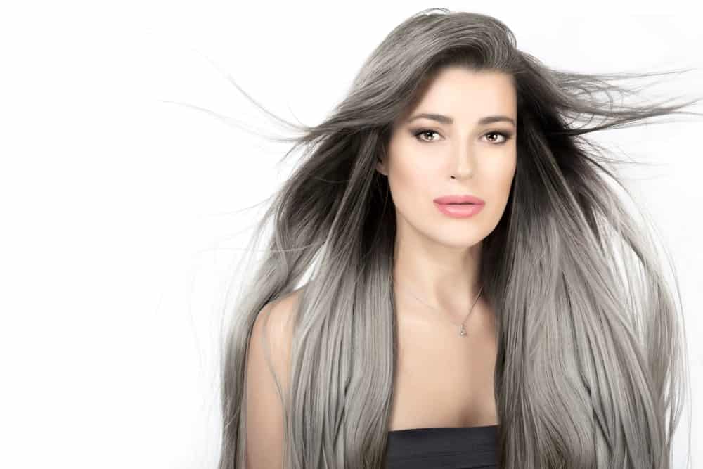 Attractive woman with long silver hair.