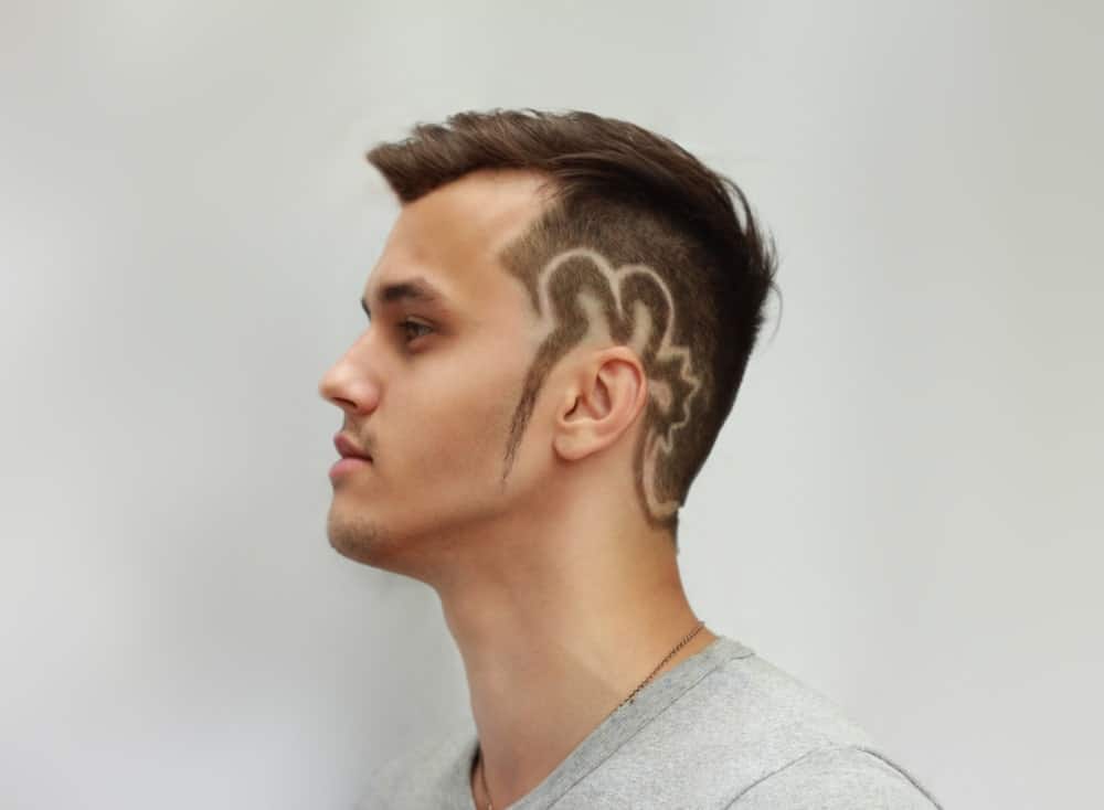 This is probably the boldest of all undercut hairstyles since this one includes a hair tattoo that starts from the sides and extends all the way down towards the nape of the neck. It is a mixture of the short undercut and the side-swept undercut, just with the addition of a funky and unique hair tattoo. 