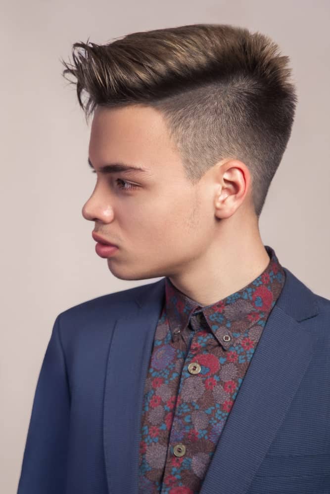 This is one of those fancy and slick undercuts that look exceptionally stylish, but are yet so simple. The front and back seem to have quite thicker and longer while the sides have been shaved with great precision. The hair from the front has also been swept a little towards the side that adds a touch of grace to the overall look. 