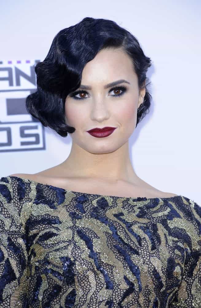 Demi Lovato na předávání cen American Music Awards 2015, které se konalo 22. listopadu 2015 v divadle Microsoft Theater v Los Angeles, USA.