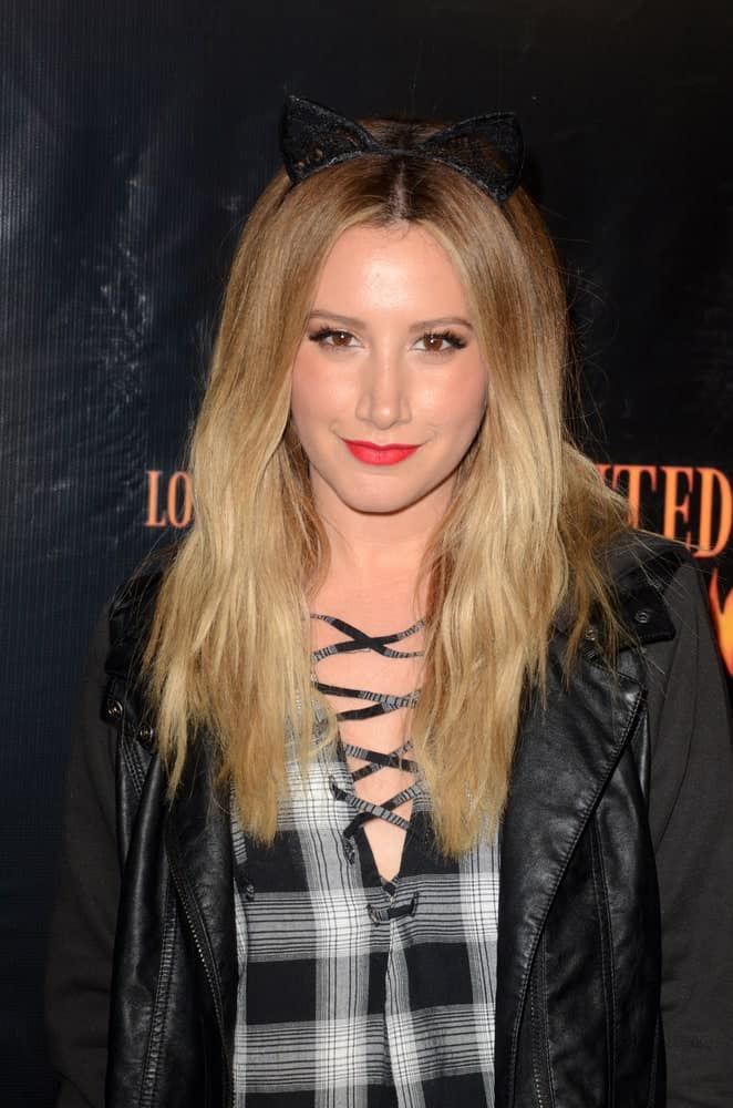 Ashley Tisdale exhibited an outrageous look during the Haunted Hayride 8th Annual VIP Black Carpet Event at the Griffith Park on October 9, 2016, with her tousled blonde hair complemented by cat ears headband.