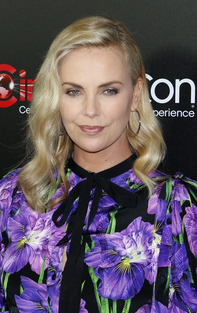 Charlize Theron looked charming in a floral dress paired with a permed hairstyle that’s side-parted. This look was worn during the Focus Features Luncheon And Studio Program Celebrating 15 Years held on March 29, 2017.