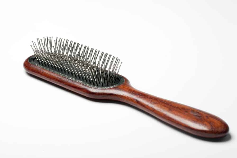 Hair brush with metal bristles.