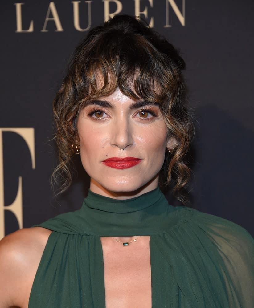 The actress slayed the ELLE Women in Hollywood on October 14, 2019, with a classic updo incorporated with eye-skimming bangs and curly tendrils on the sides.