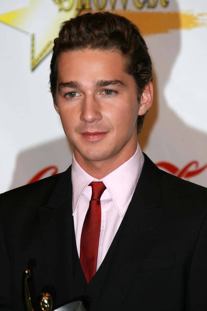 Shia LaBeouf was at the ShoWest 2007 Awards Ceremony in Las Vegas. He was wearing a dark suit paired with a red tie finished off by his classy pompadour curly hairstyle.