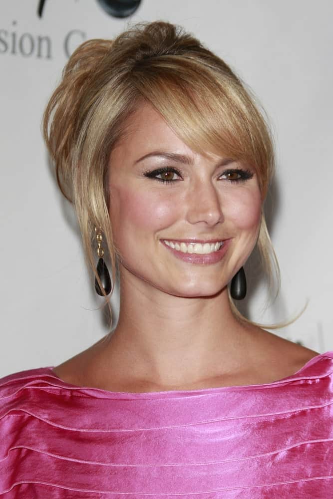 The model at the Disney ABC Television Group Summer All Star party last July 12, 2008, showcasing a sweet and charming aura with her upstyle hairstyle. It is paired with a pink dress that complements her flushed makeup look.