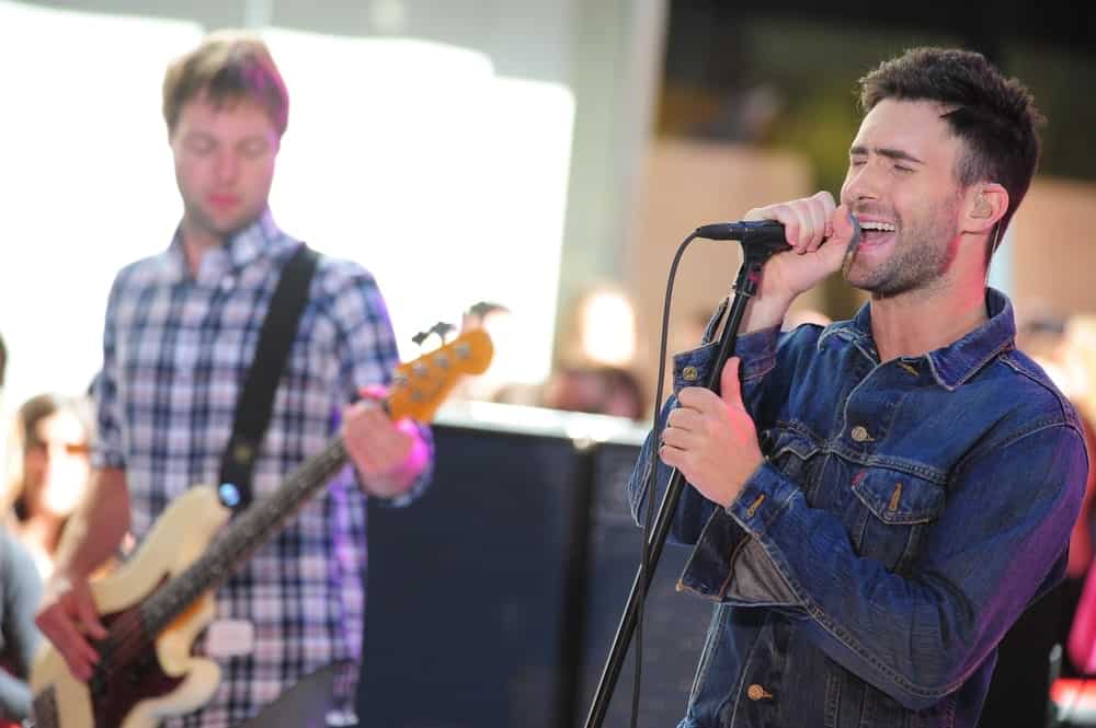 Adam Levine was on stage for NBC Today Show Concert with Maroon 5 in New York on July 2, 2010. He paired his edgy denim jacket with a side-parted fade hairstyle and five o'clock shadow.