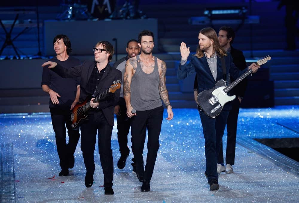 Members of Maroon 5 walked the runway during the 2011 Victoria's Secret Fashion Show on November 9, 2011 in New York City. Levine wore an edgy gray wife beater with his dress pants and leather shoes to match his pompadour hairstyle.