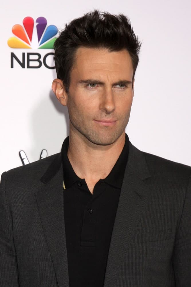 Adam Levine's sexy five o'clock shadow pairs quite well with his brushed-up spiked fade hairstyle at the "The Voice" Season 7 Red Carpet at the Universal City Walk on November 24, 2014 in Los Angeles, CA.