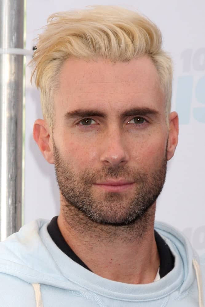 Adam Levine dyed his hair blond and styled it to a side-swept undercut pompadour look at the 2014 Wango Tango at Stub Hub Center on May 10, 2014 in Carson, CA.